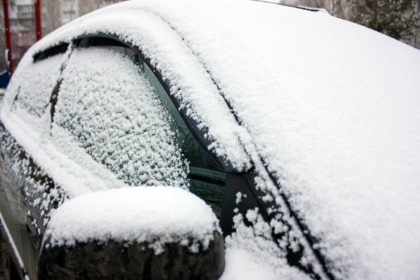 istock The car is covered with white fluffy snow. Winter 1185678691