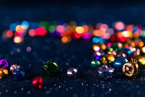 istock Colorful Christmas jingle bells. Blue filter. Blurred bokeh background. 1185679357
