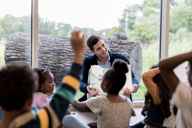 istock Dad reads to his child's class 1185682033