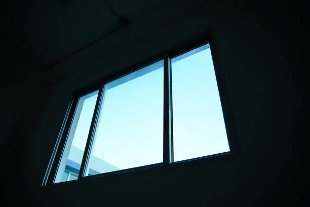 istock Looking the blue sky through bedroom windows 1185682410