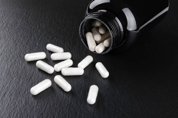 istock food supplement capsules on black background closeup 1185682437