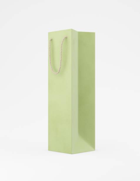 istock Eco packaging mockup bag kraft paper with handle half side. Tall narrow green template on white background promotional advertising. 3D rendering 1185683508