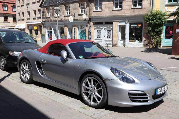 Porsche Boxster roadster Silver Porsche Boxster roadster sports convertible car parked in Germany. There were 45.8 million cars registered in Germany (as of 2017). fuerth stock pictures, royalty-free photos & images