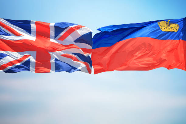 istock British and Liechtenstein flags amid blue skies 1185686958