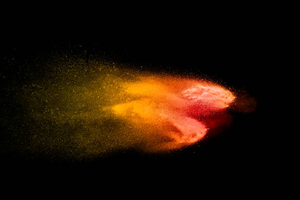 istock Orange red  powder explosion on black background.Orange red color dust splash clouds. 1185687074