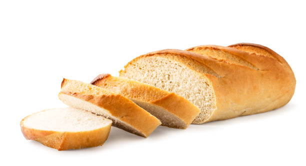 istock Loaf of white bread cut into pieces close-up. Isolated 1185702080