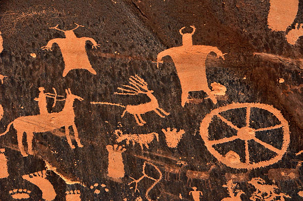 istock Ancient Native American cave drawings of animals and tools 118570929
