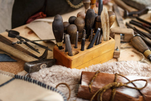 istock Set of leather working tools on working desk 1185712003