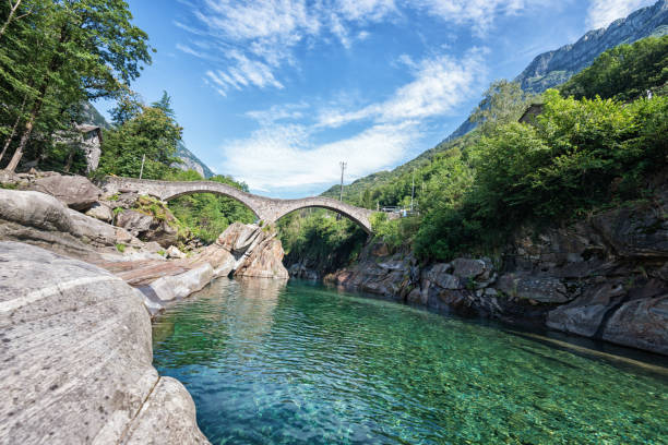 stone bridge ponte des salti over river verzasca in switzerland - riverbed switzerland valley stone imagens e fotografias de stock