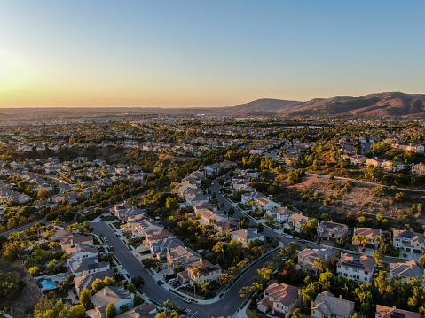 Aerial view of residential modern subdivision during sunset