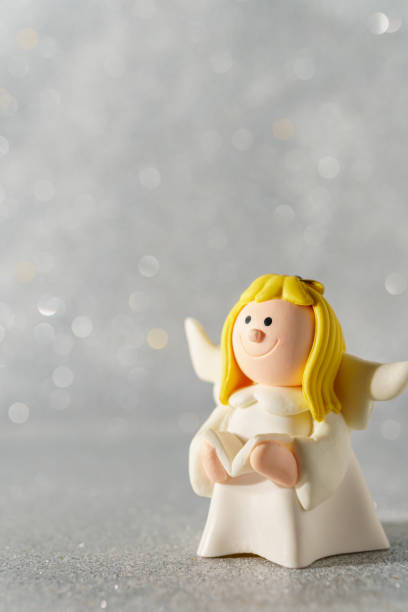 istock Angel figurine on a beautiful bokeh background with empty space for text. 1185717950