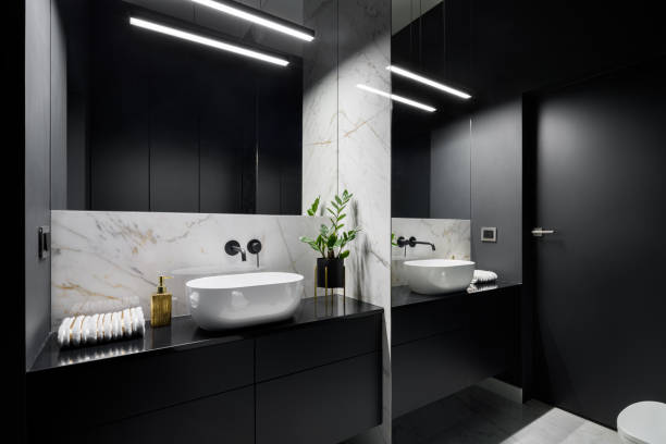 Black bathroom with mirror wall Elegant black bathroom with mirror wall and decorative marble tiles mal stock pictures, royalty-free photos & images