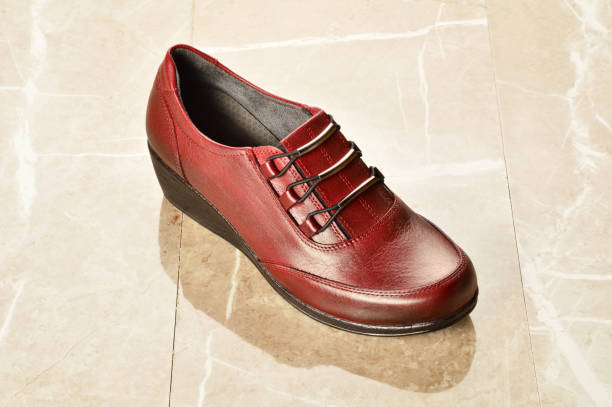 istock Womens's Shoes on the Marble Background 1185719059