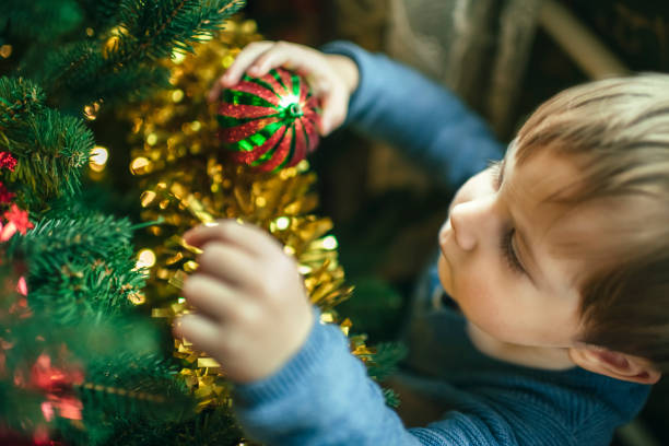 Happy child and mother preparing for Xmas