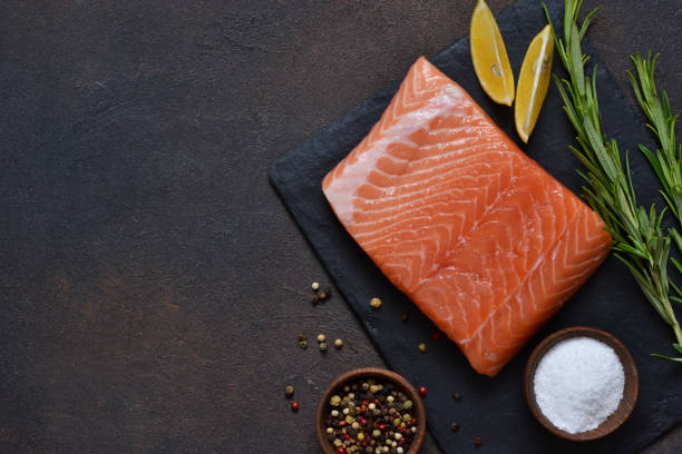 istock Raw fish salmon filet prepared for cooking. View from above. 1185719254
