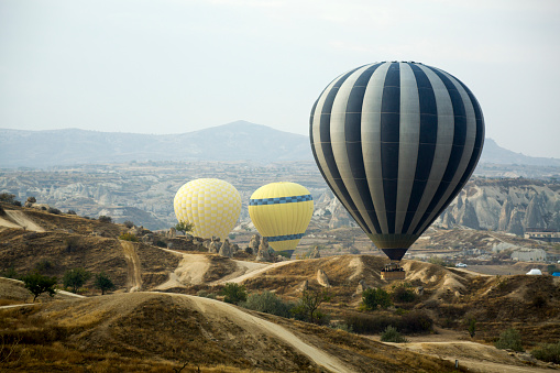 Scenic view of hot air balloons flying over Cappadocia in Turkey