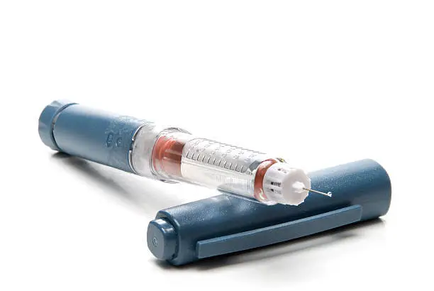 Photo of Insulin pen with blue cap and needle