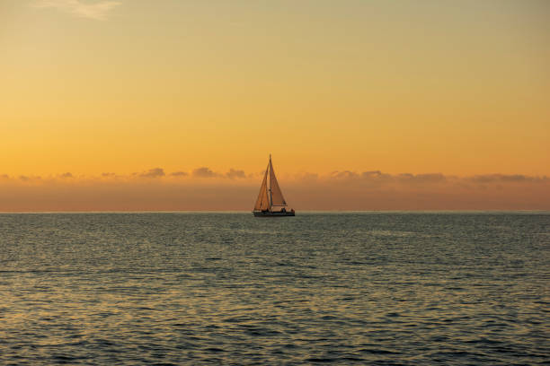 istock Sailboat sailing at dawn in Alcocebre 1185725718
