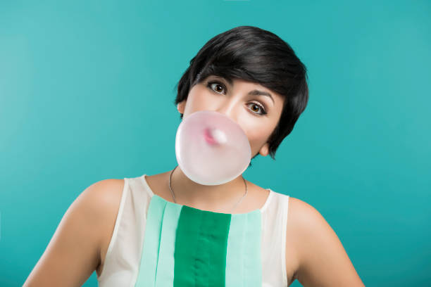 istock Girl with a bubble gum 1185727199