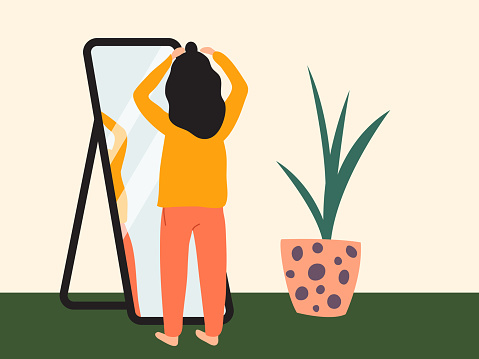 Dark-haired girl doing half up top knot in front of a mirror. Woman wearing comfy clothes at home getting ready to go out. Flat vector illustration