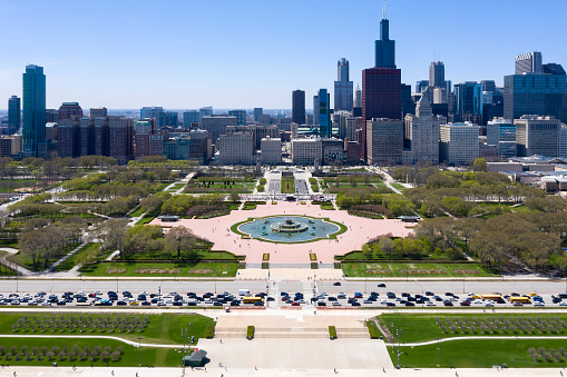 Chicago, Illinois, cityscape and Grant Park with Buckingham Fountain and S Lake Shore Drive with traffic jam, aerial view.