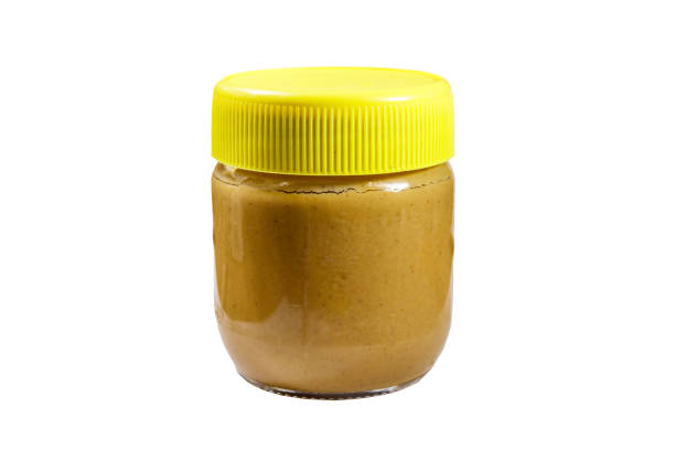 istock Jar of peanut butter isolated on white background 1185730077