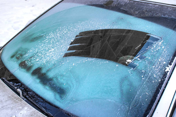 istock cleared the frost on the windshield in the cold, front and rear blurring the background 1185733095