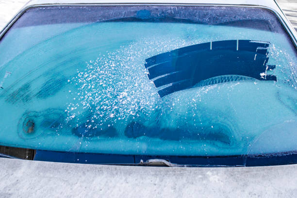 istock cleared the frost on the windshield in the cold, front and rear blurring the background 1185733096