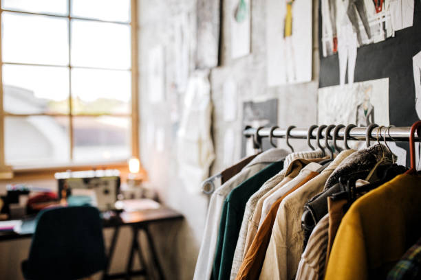 istock Clothes hanging in modern boutique 1185735947