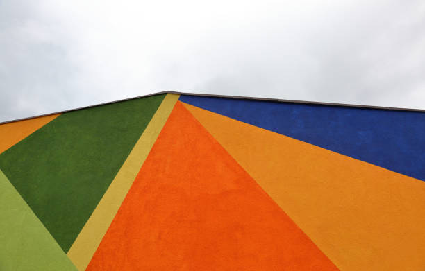 istock Colored wall on a background of cloudy sky 1185738080