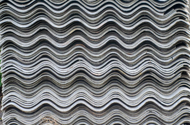 istock Old wavy slate sheets lie on top of each other 1185738282