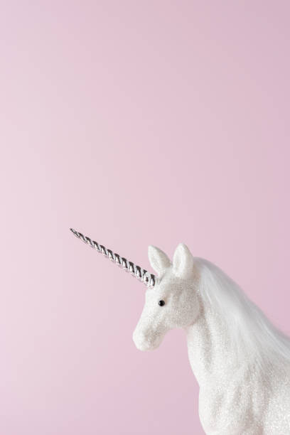 istock Creative composition with glitter unicorn on pink background. Minimal holiday concept. 1185740030