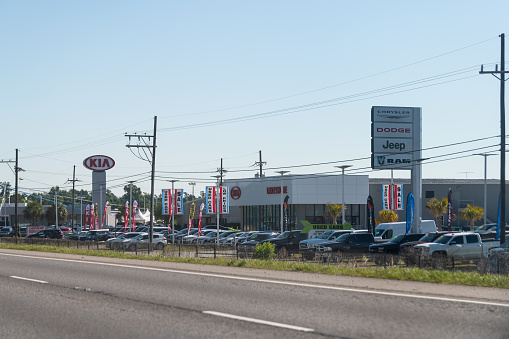 Slidell, USA - April 24, 2018: Highway i10 interstate 10 near New Orleans with sign for Kia dealer car dealership