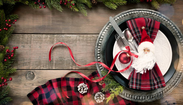 istock Christmas Dining Plate and Napkin on an Old Wood Table 1185742730