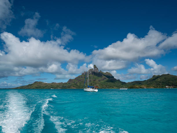 istock Sailing a boat around blue lagoon at Bora Bora island 1185743015