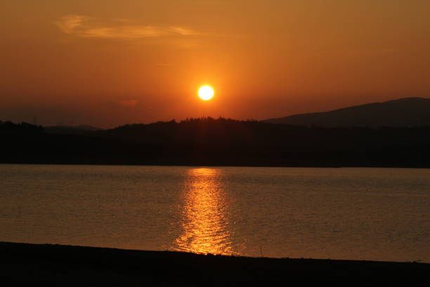istock sunset sea sun sea waves glow moonlight sun glare 1185743998