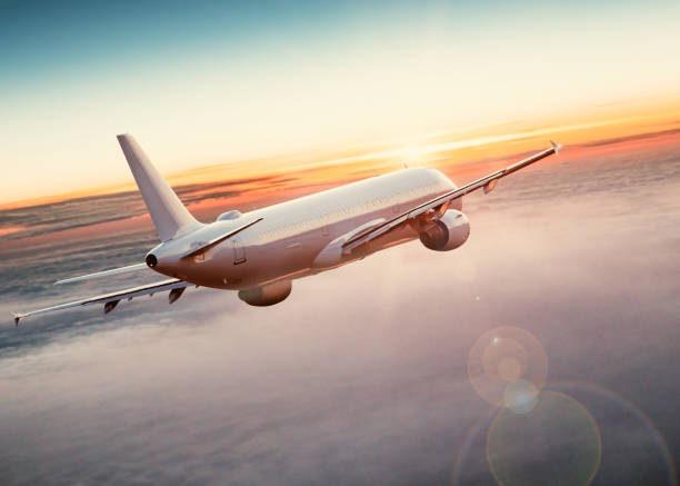 istock Commercial airplane flying above dramatic clouds. 1185744991