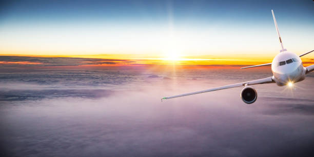istock Commercial airplane flying above dramatic clouds. 1185744998