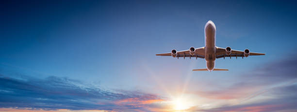 istock Commercial airplane flying above dramatic clouds. 1185745013