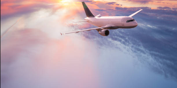 istock Commercial airplane flying above dramatic clouds. 1185745018