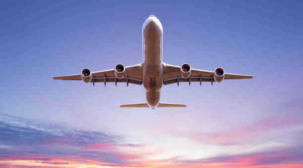istock Commercial airplane flying above dramatic clouds. 1185745035
