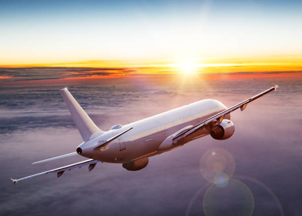 istock Commercial airplane flying above dramatic clouds. 1185745044