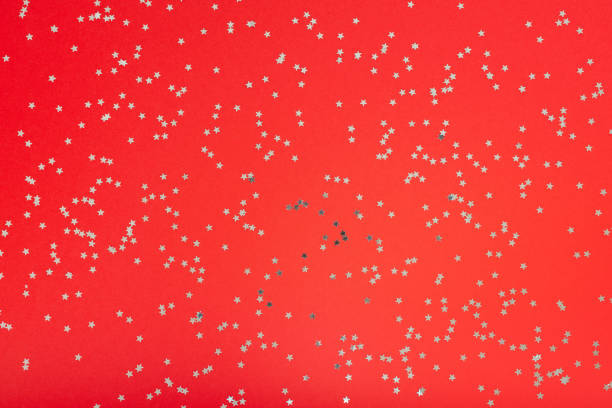 istock Red background with glitter silver stars 1185745138