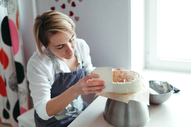 istock A middle aged woman confectioner or baker. 1185745616
