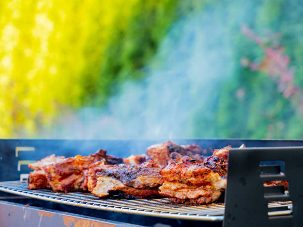 istock grilled barbecue pork ribs with smoke 1185751034