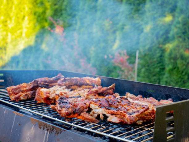 istock grilled barbecue pork ribs with smoke 1185751146