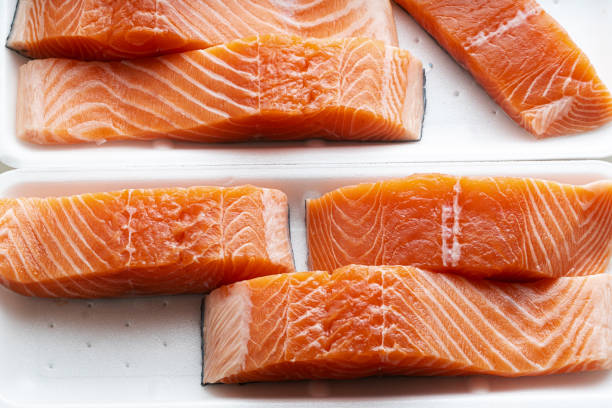 istock fresh salmon, cut into pieces and ready for cooking. fish cutting 1185752029