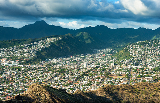This photograph is of suburban Honolulu neighborhoods viewed from Diamond Head on Oahu Hawaii.