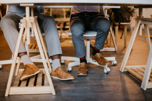istock Colleagues sitting at desk during labor 1185758016
