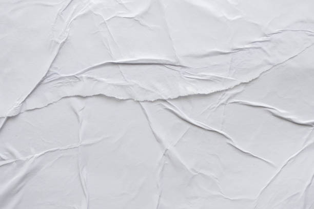 istock Blank white crumpled and creased paper poster texture background 1185760793